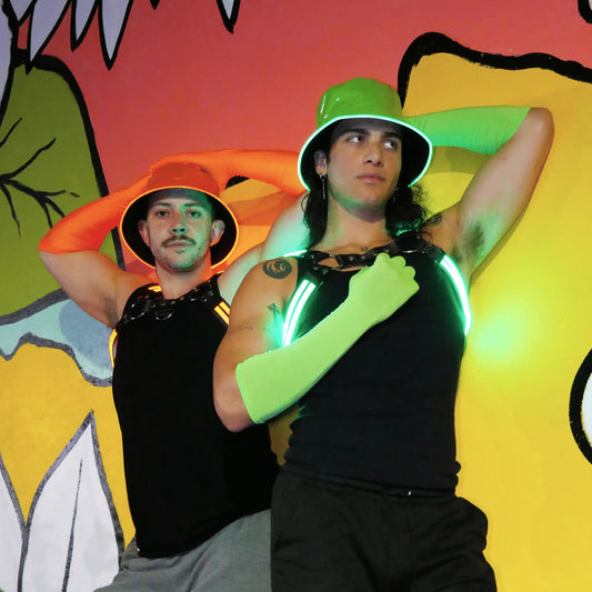 male model wearing orange LED bucket hat green festival outfit