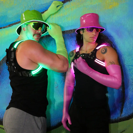 male model wearing green LED bucket hat pink festival outfit